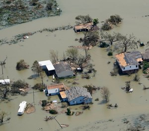 Buildings and homes are flooded in the aftermath of Hurricane Laura Thursday, Aug. 27, 2020, near Lake Charles, La. The storm killed at least six people in Louisiana.
