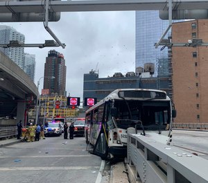 This photo provided by FDNY shows an NJ Transit bus that crashed near the Port Authority Bus Terminal in New York. The commuter bus crashed around 9:30 a.m. on an upper ramp at the Port Authority Bus Terminal in Manhattan, tossing passengers around and causing major damage to the vehicle’s front end.