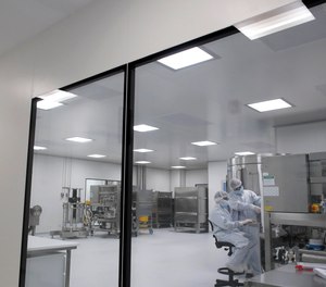 In this Aug. 14, 2020 photo, laboratory technicians work at the mAbxience biopharmaceutical company on an experimental coronavirus vaccine developed by Oxford University and the laboratory AstraZeneca in Garin, Argentina. The CDC has told states to be prepared to distribute a COVID-19 vaccine by Nov. 1.