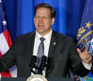 In this Feb. 10, 2020, file photo New Hampshire Republican Gov. Chris Sununu speaks at a rally in Portsmouth, N.H.