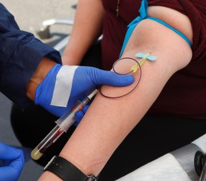This photo shows blood being drawn for a COVID-19 antibody test. Maryland Gov. Larry Hogan announced Monday that all firefighters in the state will be tested for antibodies through a partnership between the state Department of Health and the Professional Fire Fighters of Maryland. (AP Photo/Paul Sancya)