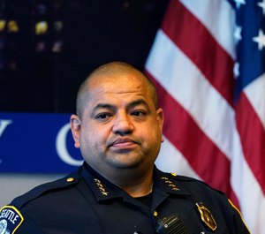 Interim Seattle Police Chief Adrian Diaz listens to a question during a news conference about changes being made at the department Wednesday, Sept. 2, 2020, in Seattle. (AP Photo/Elaine Thompson)