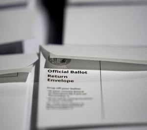 Stacks of ballot envelopes waiting to be mailed are seen at the Wake County Board of Elections in Raleigh, N.C.