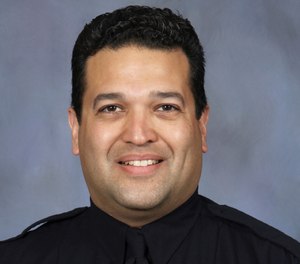 This photo provided by the Lincoln, Neb., police department, shows Lincoln police officer Luis