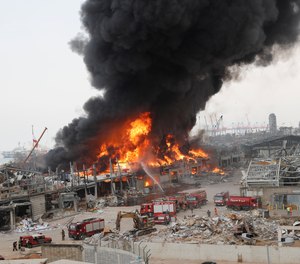 A large fire burns in the port in Beirut, Lebanon, Thursday, Sept. 10. 2020. The fire broke out near the site of a massive explosion in August that killed more than 190 people.
