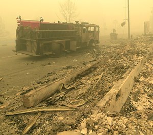 A fire engine from the Idanha-Detroit Rural Fire Protection District sits on Detroit Avenue Friday, Sept. 11, 2020, in Detroit, Ore. The engine was destroyed on Wednesday when the Lionshead Fire over-ran the resort community of Detroit, Ore., merging with the Beachie Creek Fire.