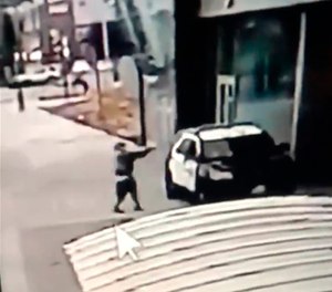 A screen grab from a security camera video released the Los Angeles County Sheriff's Department shows a gunman walking up to sheriff's deputies and opening fire without warning or provocation in Compton, Calif., on Saturday, Sept. 12, 2020.