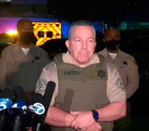 This still image taken from video released by the Los Angeles County Sheriff's Department, shows Sheriff Alex Villanueva taking questions at a late-night news conference about the condition of two Sheriff's deputies in Compton, Calif on Saturday, Sept. 12, 2020.