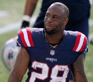 New England Patriots running back James White stands on the sideline in the second half of an NFL football game against the Miami Dolphins, Sunday, Sept. 13, 2020, in Foxborough, Mass.