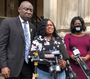 Tamika Palmer, mother of Breonna Taylor, addresses the media in Louisville, Ky., on Thursday, Aug. 13, 2020. The city of Louisville will pay $12 million to Taylor's mother and install police reforms to settle a lawsuit from Taylor’s family.