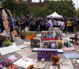 People gather in Jefferson Square awaiting word on charges against police officers, Wednesday, Sept. 23, 2020, in Louisville, Ky. A grand jury has indicted one officer on criminal charges six months after Breonna Taylor was fatally shot by police in Kentucky. The jury presented its decision against fired officer Brett Hankison Wednesday to a judge in Louisville, where the shooting took place.