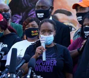 State Rep. Attica Scott speaks during a news conference, Friday, Sept. 25, 2020, in Louisville, Ky. (AP Photo/Darron Cummings)