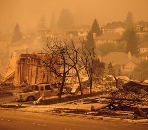 Homes leveled by the Glass Fire line a street in the Skyhawk neighborhood of Santa Rosa, Calif., on Monday, Sept. 28, 2020. Firefighter Grant Newnom defended his girlfriend's parents' Santa Rosa home from the blaze after finishing an extended 60-hour shift on Sunday.