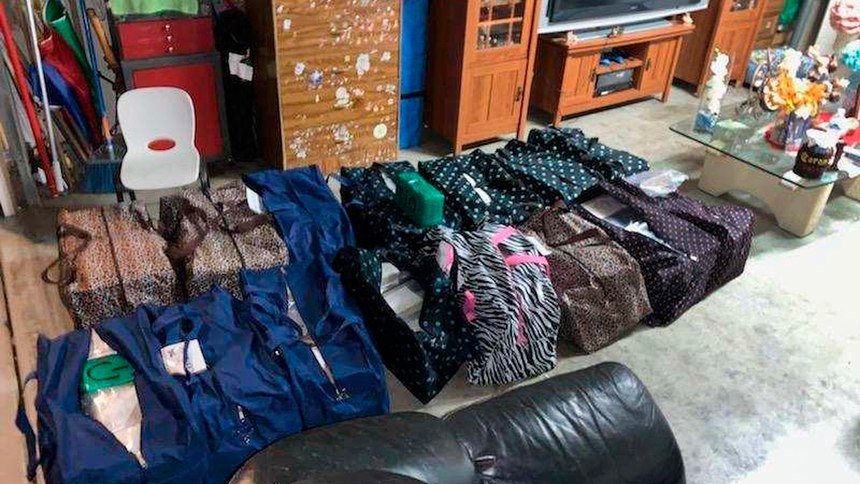 This undated image provided by the Drug Enforcement Administration shows narcotics stashed in a house in Perris, Calif. DEA agents authored state search warrants for multiple locations, including the courier target's residence and a narcotics stash house within the city of Perris, Calif. During a search of the courier's residence, agents located approximately 25 duffle bags within the garage of the residence containing approximately 406 kilograms of cocaine, six kilograms of heroin, and 650 pounds of crystal methamphetamine, and approximately 1,600 pounds of crystal methamphetamine.
