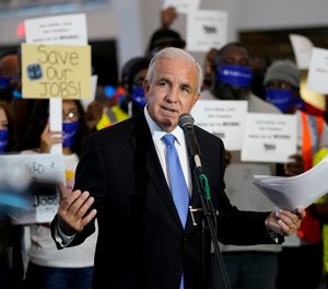 Miami-Dade County Mayor Carlos Gimenez speaks during a protest at PortMiami by workers in the cruise ship industry wanting to return to work. The CDC had issued a No Sail Order for cruise ships through Oct. 31 during the coronavirus pandemic.