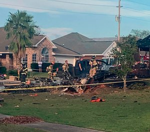 A U.S. Navy training plane crashed in an Alabama residential neighborhood near Foley, Ala.