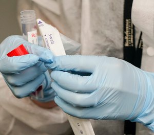 A Medical Assistant administers a Covid test as part of plans by the Metropolitan Transportation Authority to test workers Tuesday, Oct. 27, 2020.