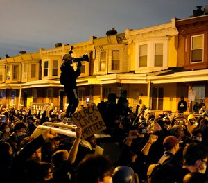 Protesters confront police during a march Tuesday Oct. 27, 2020 in Philadelphia.