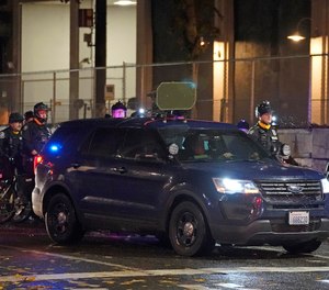 A Seattle Police vehicle with a high-volume speaker mounted on top sits parked in front of the SPD East Precinct building, Wednesday, Nov. 4, 2020, as protesters clashed with police in Seattle. The speaker is part of a new practice by Seattle police to issue audible warnings to protesters during protest activities, and authorities also use to issues apologies to nearby residents for any disruptions caused by the activities.