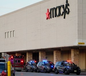 Police investigate a shooting at the Mayfair Mall, Friday, Nov. 20, 2020, in Wauwatosa, Wis.