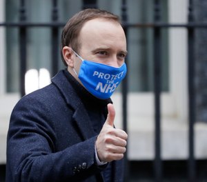 Britain's Health Secretary Matt Hancock leaves Downing Street in London, Wednesday, Dec. 2, 2020. Hancock on Wednesday thanked scientists from Pfizer and BioNTech after the approval of their COVID-19 vaccine for emergency use by the country's drugs regulator.