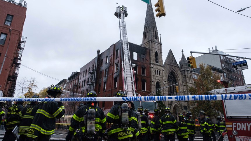 Firefighters work to extinguish the fire erupted from a building next to the Middle Collegiate Church on Saturday, Dec. 5, 2020 in New York. 