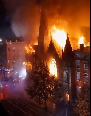 A historic 19th century church in lower Manhattan was gutted by a massive fire that sent flames shooting through the roof.
