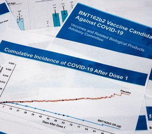 Documents created by Pfizer for the meeting with the Food and Drug Administration advisory panel, as Pfizer seeks approval for emergency use of their COVID-19 vaccine, are seen on Thursday, Dec. 10, 2020. The advisory panel has endorsed widespread use of the Pfizer vaccine in adults and teenagers 16 and over, meaning the FDA could sign off on its emergency use within days.