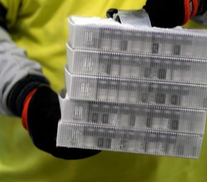 Boxes containing the Pfizer-BioNTech COVID-19 vaccine are prepared to be shipped at the Pfizer Global Supply Kalamazoo manufacturing plant in Portage, Mich., Sunday, Dec. 13, 2020.