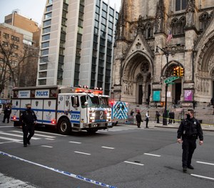 New York police officers block off the scene of a shooting at the Cathedral Church of St. John the Divine, Sunday, Dec. 13, 2020, in New York.