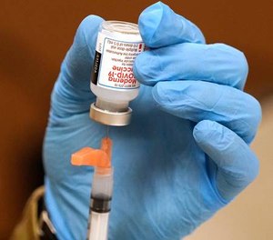 The status of prison workers who have direct contact with inmates who are positive for COVID-19 has come into question.