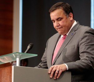 Columbus Mayor Andrew J. Ginther pauses while speaking during a press conference regarding the fatal police shooting of Andre Hill, Wednesday, Dec. 23, 2020 at the Michael B. Coleman Government Center in Columbus, Ohio.