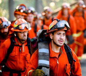 California Gov. Gavin Newsom's proposed budget asks for $143 million to fund more than 600 state firefighter positions. The state faced a shortage of available inmate firefighting crews during record-breaking fires last year.