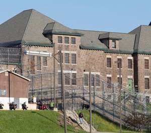 In this June 17, 2015 file photo, an employee leaves the Clinton Correctional Facility in Dannemora, N.Y.
