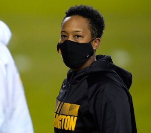 Washington full-year coaching intern Jennifer King looks on prior to an NFL wild-card playoff football game between the Washington Football Team and the Tampa Bay Buccaneers, Saturday, Jan. 9, 2021, in Landover, Md.