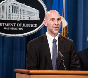 Steven D'Antuono, head of the Federal Bureau of Investigation (FBI) Washington field office, speaks as acting U.S. Attorney Michael Sherwin, right, listens during a news conference Tuesday, Jan. 12, 2021, in Washington.