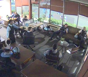 This still image taken from security video shows Chicago police inside Rush's burglarized congressional campaign office in Chicago on Sunday, May 31, 2020.