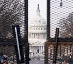Security surrounds the U.S. Capitol in Washington, Friday, Jan. 15, 2021, ahead of the inauguration of President-elect Joe Biden and Vice President-elect Kamala Harris.
