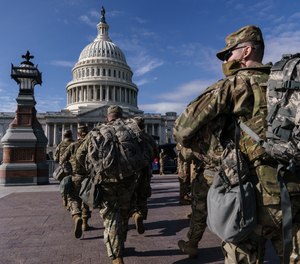 National Guard troops reinforce security around the U.S. Capitol ahead of expected protests leading up to President-elect Joe Biden's inauguration, in Washington, Sunday, Jan. 17, 2021.