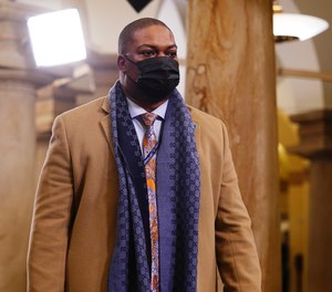 Capitol Police officer Eugene Goodman arrives in the Crypt of the US Capitol for President-elect Joe Biden's inauguration ceremony on Wednesday, Jan. 20, 2021 in Washington.