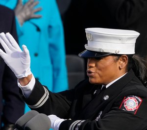 Fire Capt. Andrea Hall signs the Pledge of Allegiance at the 59th Inaugural Ceremonies of President Joe Biden and Vice President Kamala Harris.