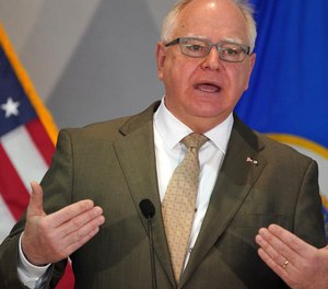 Minnesota Gov. Tim Walz answers a question from a reporter during a news conference Tuesday, Jan. 26, 2021 in St. Paul, Minn.