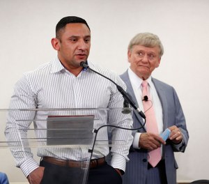 Houston Police officer Felipe Gallegos speaks as lawyer Rusty Hardin listened during a press conference at Hilton Americas, Tuesday, Jan. 26, 2021, in Houston.