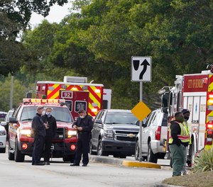 Law enforcement officers block an area where a shooting killed two FBI agents while serving an arrest warrant, Tuesday, Feb. 2, 2021, in Sunrise, Fla.