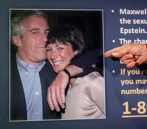 In this July 2, 2020, file photo, Audrey Strauss, acting U.S. attorney for the Southern District of New York, points to a photo of Jeffrey Epstein and Ghislaine Maxwell during a news conference in New York.