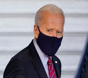 President Joe Biden walks to board Marine One on the South Lawn of the White House in Washington.