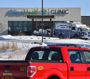 A Minneapolis Bomb Squad vehicle is parked near the entrance to the Allina Health Clinic Tuesday, Feb. 9, 2021, in Buffalo, Minn.