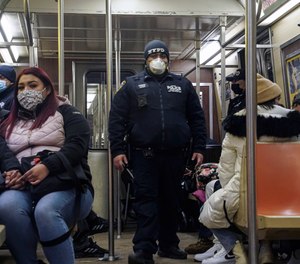 Police patrol the A line subway train bound to Inwood, after NYPD deployed an additional 500 officers into the subway system following deadly attacks, Saturday Feb. 13, 2021, in New York.