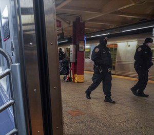 Police patrol the A line subway train bound to Inwood, after NYPD deployed an additional 500 officers into the subway system following deadly attacks, Saturday Feb. 13, 2021, in New York.