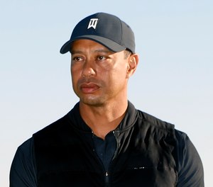 Golf star Tiger Woods was extricated from his vehicle after a rollover crash in Los Angeles County on Tuesday.